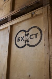 Exact logo printed on wooden storage crate